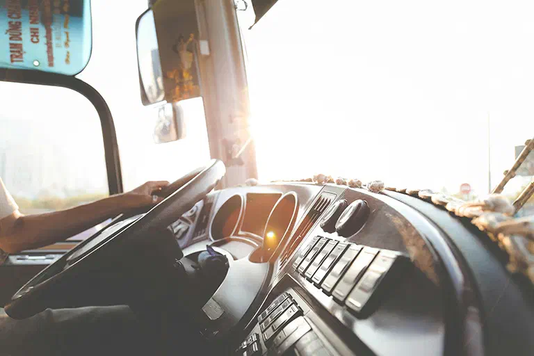 A photo a person driving a semi truck. A photo a person driving a semi truck.