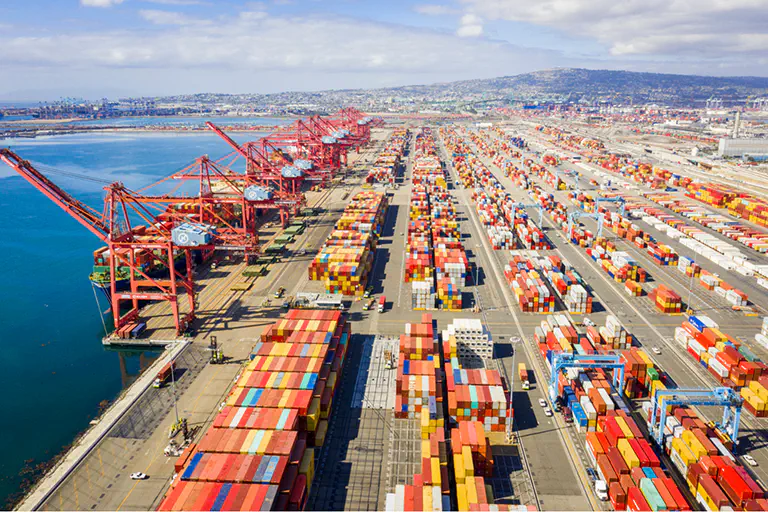 A photo of an active sea port with thousands of containers ready for loading or unloading.