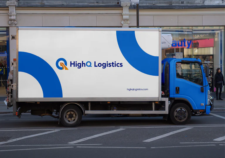 A photograph of a semi truck with HighQ Logistics branding.