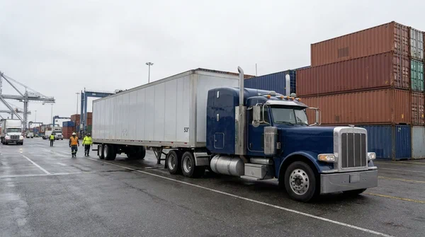 Blue semi truck at loading docks Blue semi truck at loading dock
